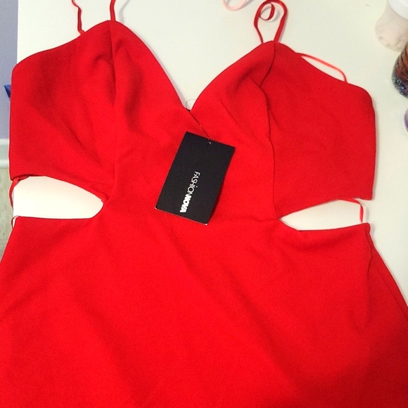 Beautiful red dress with cut outs and a large split at the side. - Picture 1 of 2